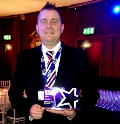 Store Manager Michael Shiels with the award.